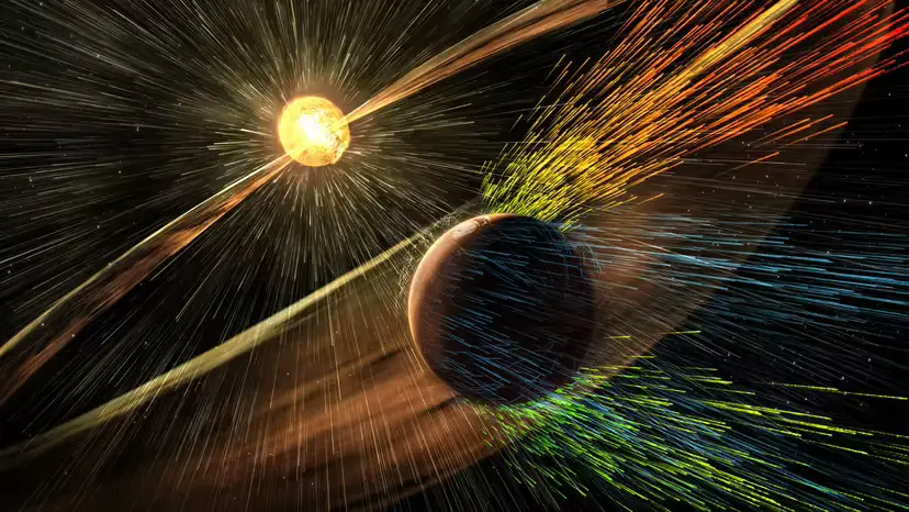 Artist’s rendering shows a solar storm hitting Mars and stripping ions from the planet's upper atmosphere - Credits: NASA/GSFC